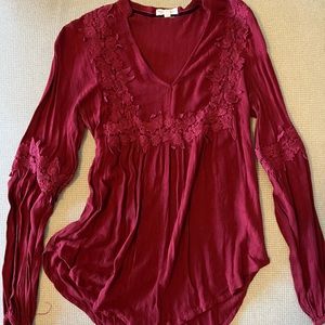 Maroon long sleeve blouse.
